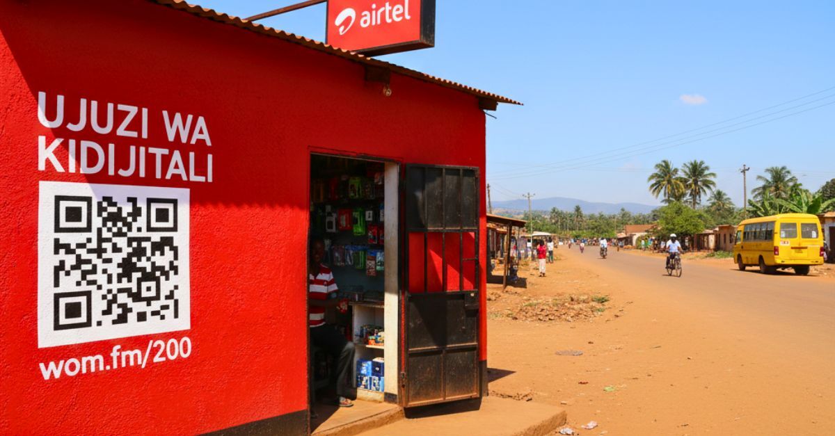 Roadside shop in Africa with a QR code that leads to a WOM.fm playlist about Digital Financial Literacy in Swahili.